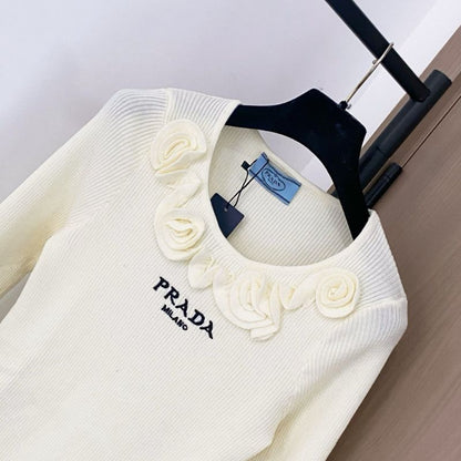 Prada ribbed knit sweater with floral appliqués on the collar