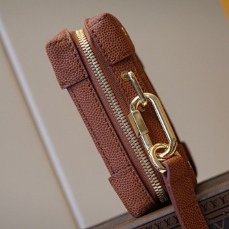 Louis Vuitton x NBA Soft Trunk Wearable Wallet in Ball Grain Leather.