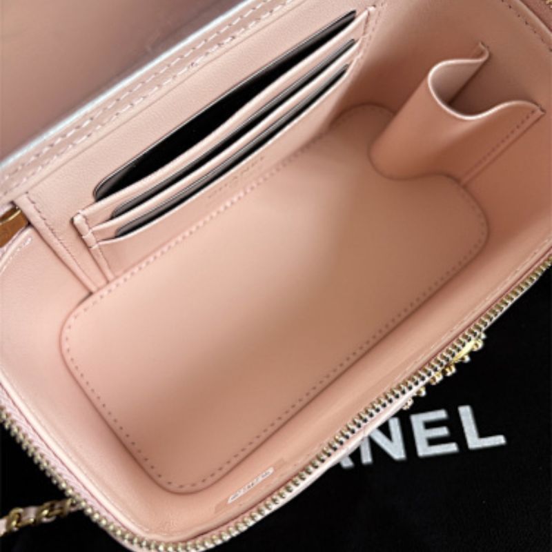 Chanel Small Classic Quilted Vanity Case in a light pink hue.