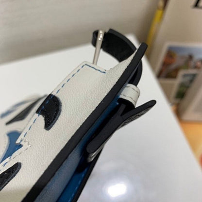 Loewe T Pouch clutch bag in a unique blue, black, and white leather