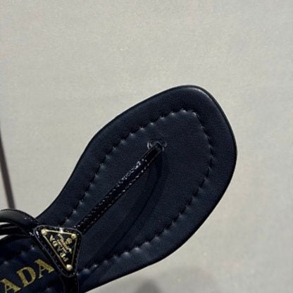 Prada Patent Leather Thong Sandals in classic black ("Nero")