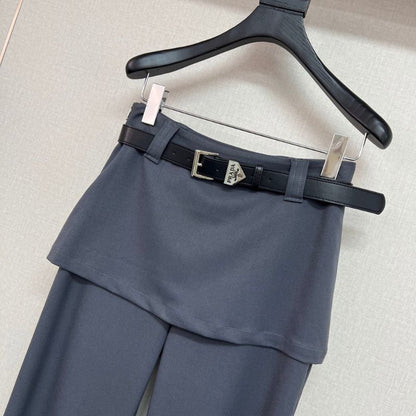 Prada layered trousers with a wrap-around skirt overlay.