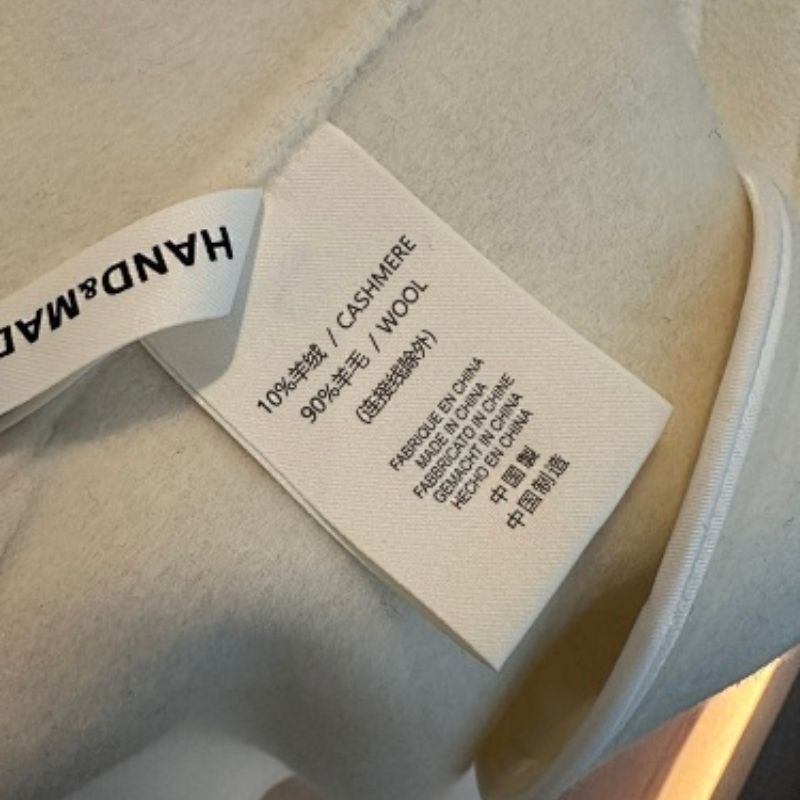 HERMES PARIS  asymmetrical wrap coat with a buckle closure