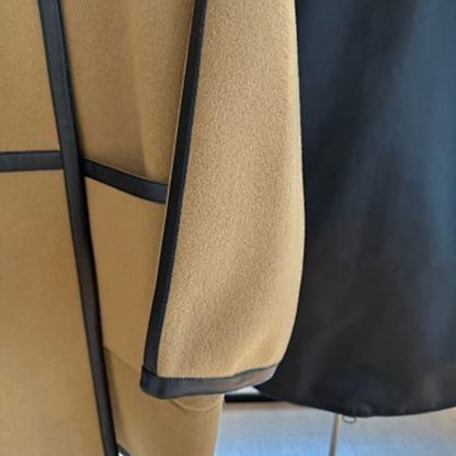 Hermès mid-length tan coat  collarless, open-front coat