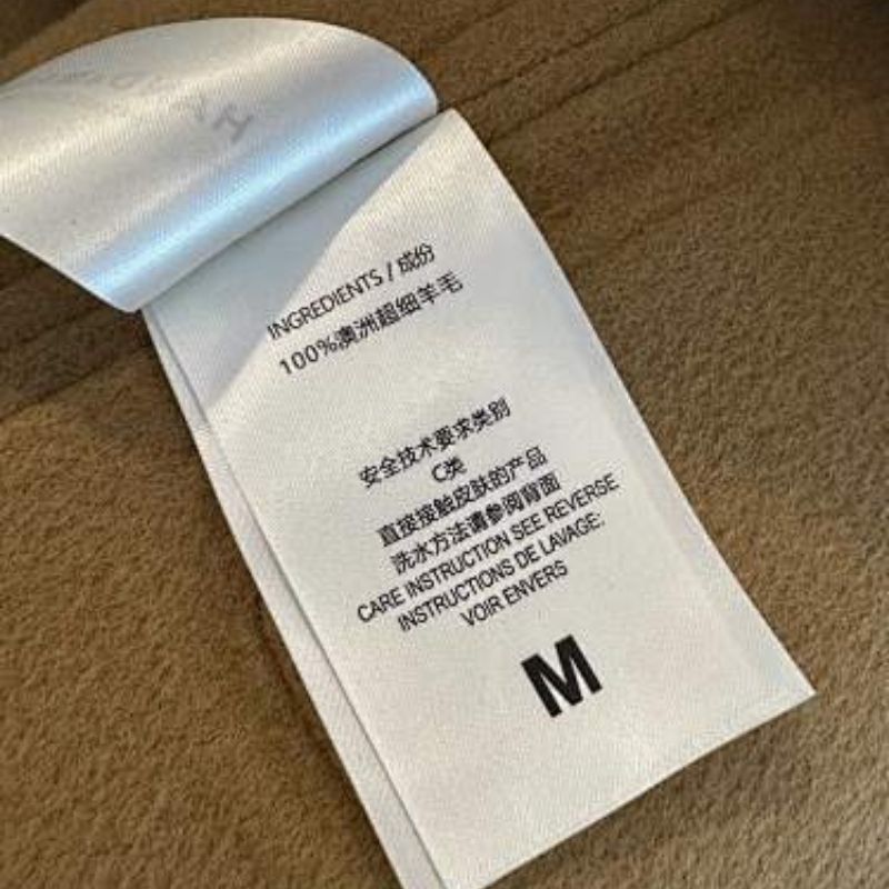 Hermès mid-length tan coat  collarless, open-front coat