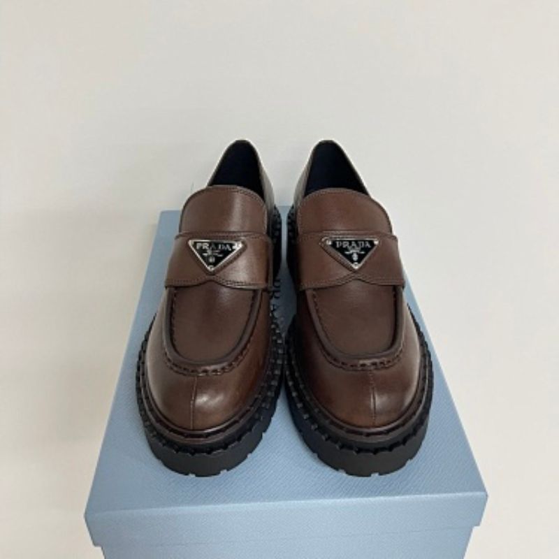 Prada Chocolate Brushed Leather Loafers in a deep ebony dark brown ("Ebano") colorway.