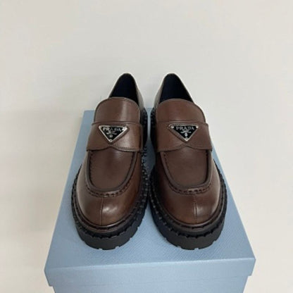Prada Chocolate Brushed Leather Loafers in a deep ebony dark brown ("Ebano") colorway.