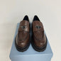 Prada Chocolate Brushed Leather Loafers in a deep ebony dark brown ("Ebano") colorway.