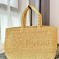 Saint Laurent Rive Gauche raffia tote bag.