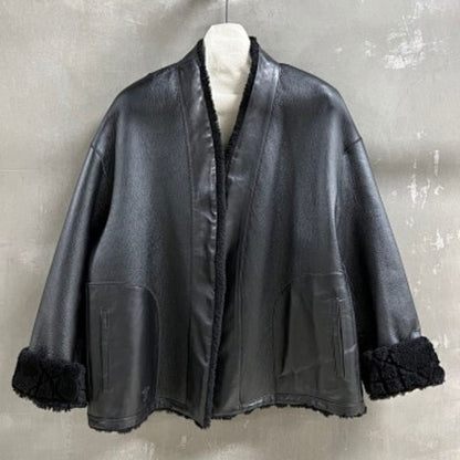 Christian Dior black double-faced leather-effect jacket with faux shearling lining and trim.