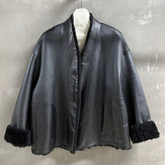 Christian Dior black double-faced leather-effect jacket with faux shearling lining and trim.