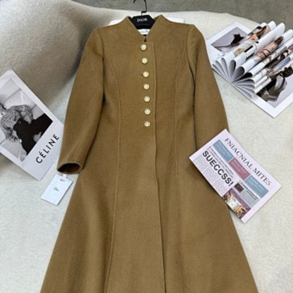 Christian Dior camel coat with gold-tone logo buttons.