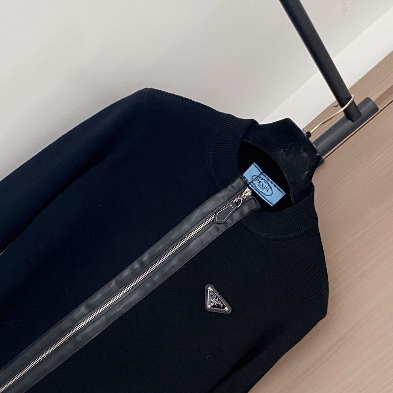 Prada black knit jacket with a full zip closure.