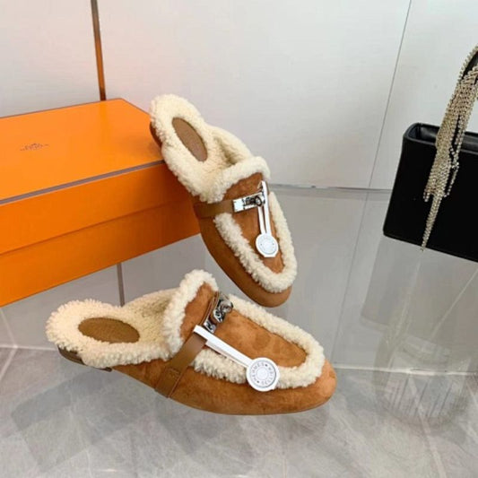 Hermès Carlotta Mules in the Gold (tan) shearling variation.
