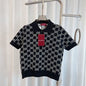 Gucci Reversible GG wool jacquard polo shirt in black and white.