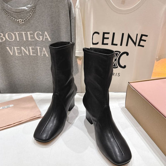 Miu Miu black leather square-toe ankle boots with a zipper closure