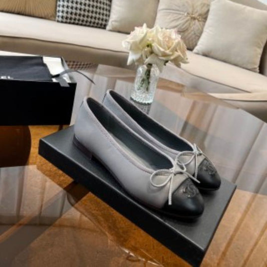 Chanel Lambskin Cap Toe CC Ballerina Flats.