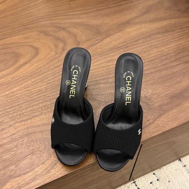 Chanel Ribbed Knit Open-Toe Mules in black.
