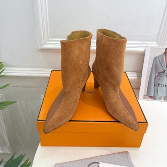 Hermès Rouxa Ankle Boots in a warm camel-brown finish.Sizes: 35-39