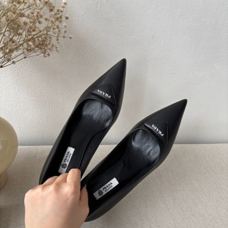 Prada 75mm Padded Triangle-Logo Leather Pumps.
