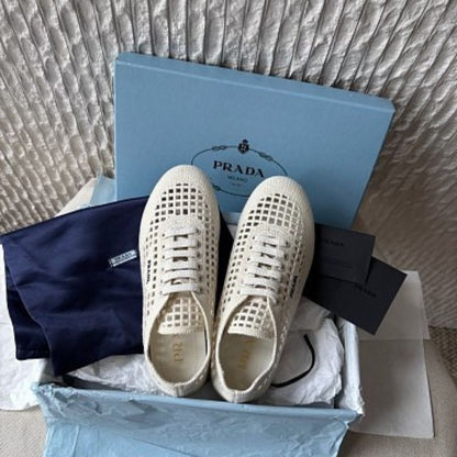 Prada Collapse Crochet Laced Sneakers in the ivory/white colorway