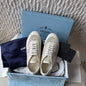 Prada Collapse Crochet Laced Sneakers in the ivory/white colorway