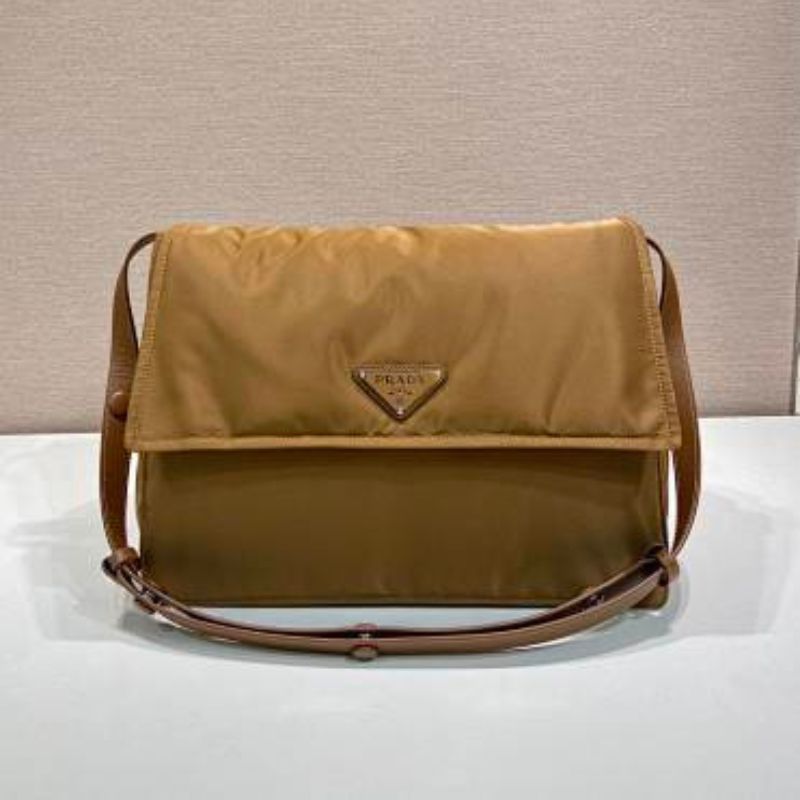 Prada Re-Nylon Large Padded Shoulder Bag in a caramel brown shade.