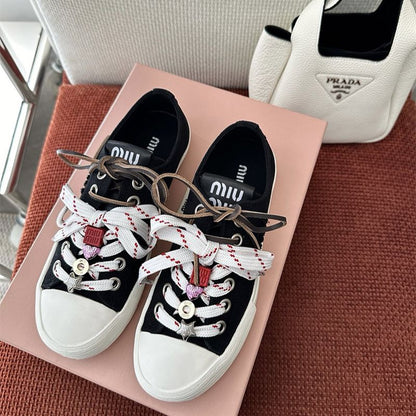 Miu Miu Washed Denim Sneakers.