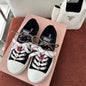 Miu Miu Washed Denim Sneakers.
