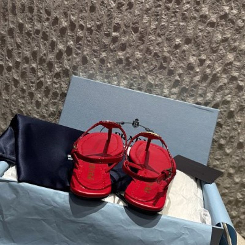 Prada Patent Leather T-Strap Enameled Triangle Logo Sandals.