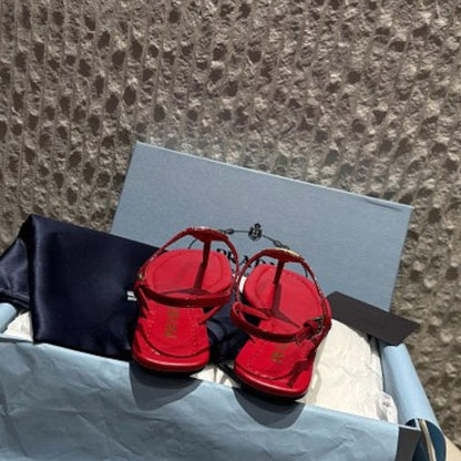Prada Patent Leather T-Strap Enameled Triangle Logo Sandals.