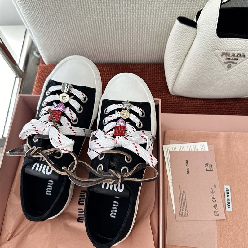 Miu Miu Washed Denim Sneakers.