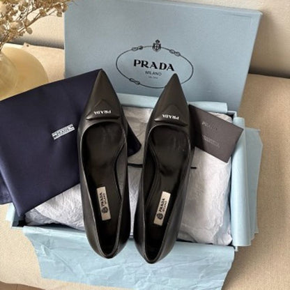 Prada 75mm Padded Triangle-Logo Leather Pumps.