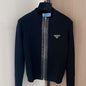 Prada black knit jacket with a full zip closure.