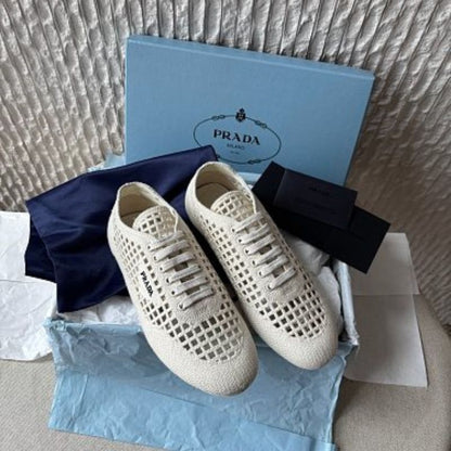 Prada Collapse Crochet Laced Sneakers in the ivory/white colorway