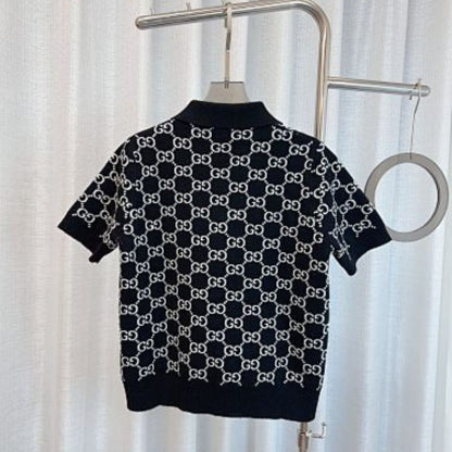 Gucci Reversible GG wool jacquard polo shirt in black and white.