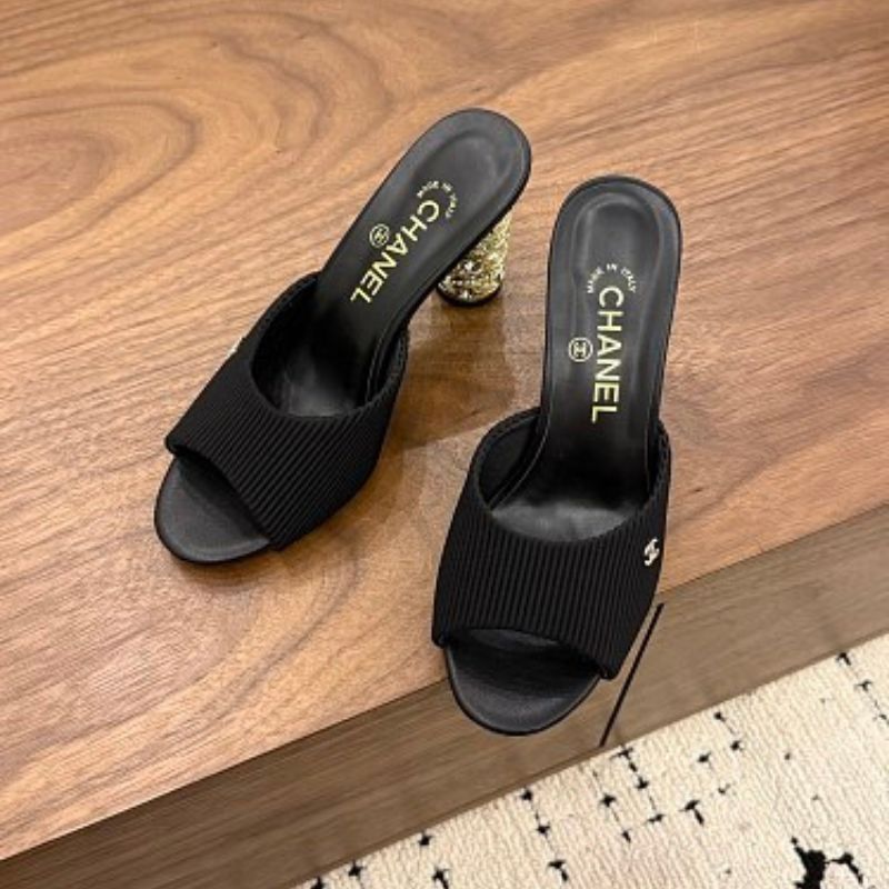 Chanel Ribbed Knit Open-Toe Mules in black.