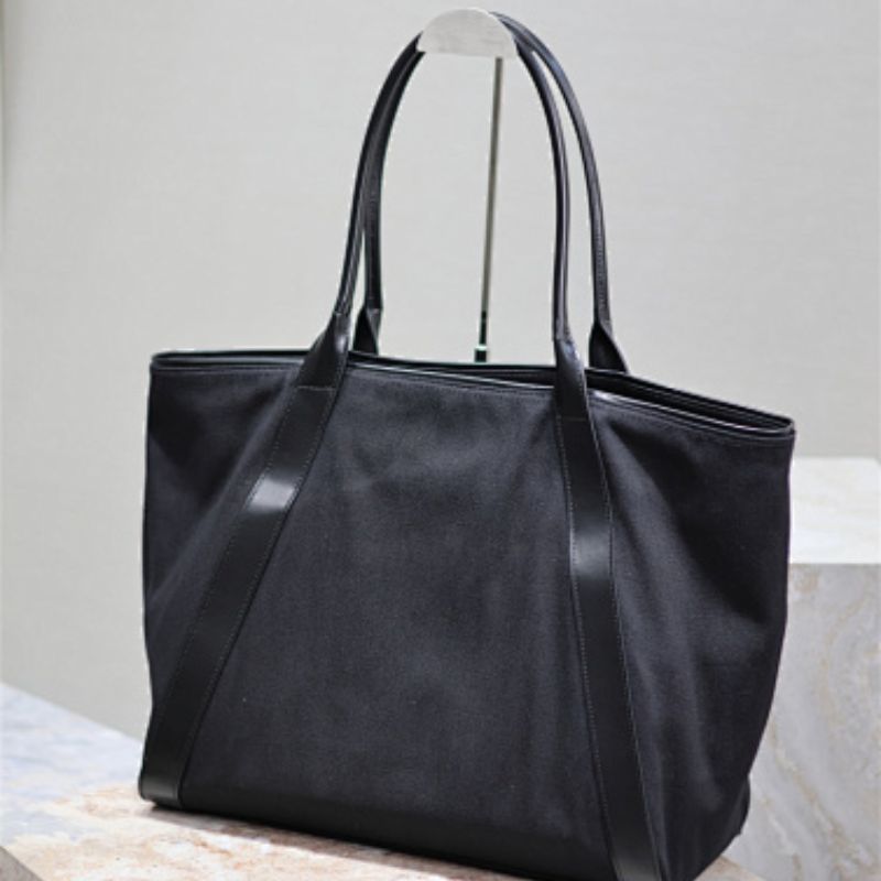 Saint Laurent Rive Gauche Round Logo Tote Bag in black.