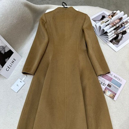 Christian Dior camel coat with gold-tone logo buttons.