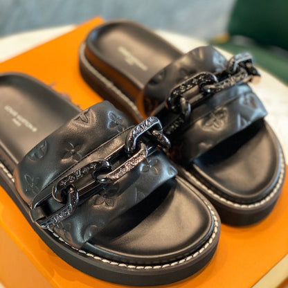 Louis Vuitton LV Sunset Flat Comfort Mule in black.