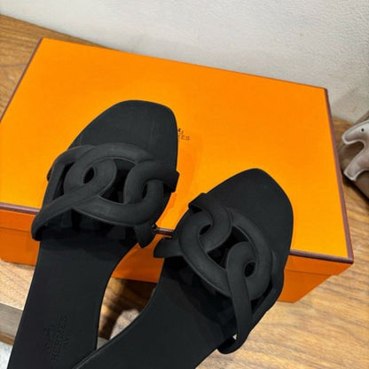Hermès Aloha Sandals in noir (black)