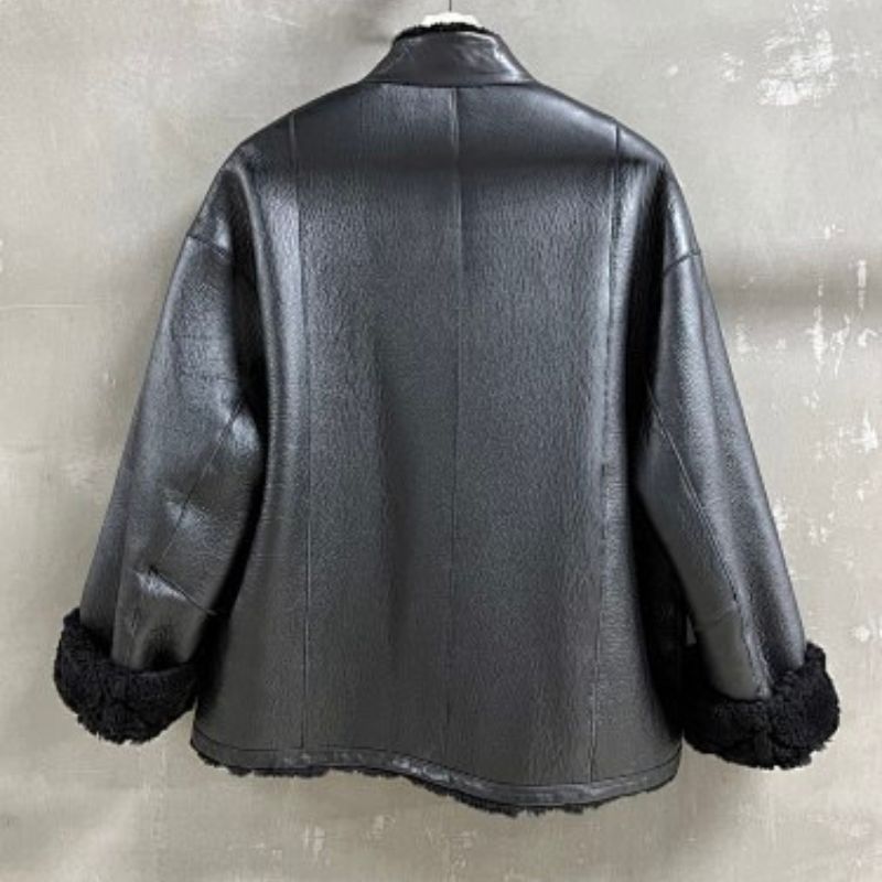 Christian Dior black double-faced leather-effect jacket with faux shearling lining and trim.