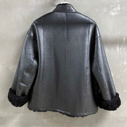Christian Dior black double-faced leather-effect jacket with faux shearling lining and trim.