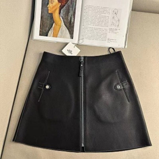 Hermès black leather A-line mini skirt with a front zipper closure