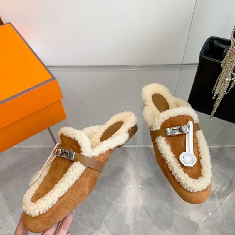 Hermès Carlotta Mules in the Gold (tan) shearling variation.