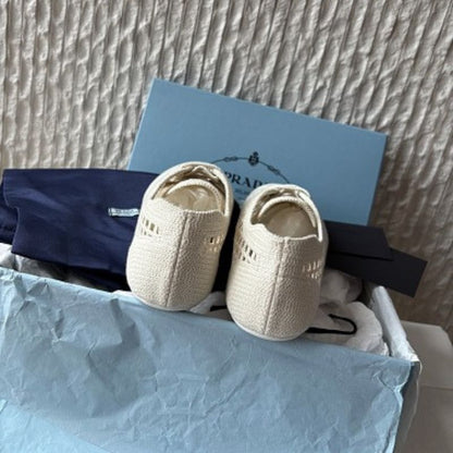 Prada Collapse Crochet Laced Sneakers in the ivory/white colorway