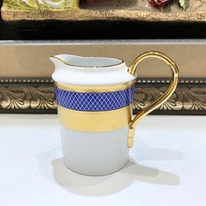 Dior royal blue and gold tea set.