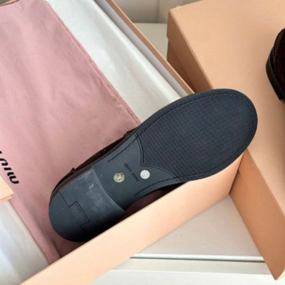 Miu Miu Suede Penny Loafers with a logo plaque