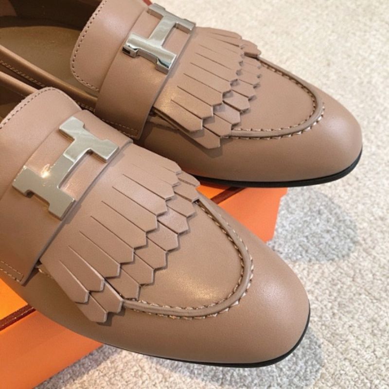 Hermès Royal Loafers in a neutral taupe/beige leather.
