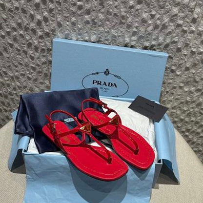 Prada Patent Leather T-Strap Enameled Triangle Logo Sandals.
